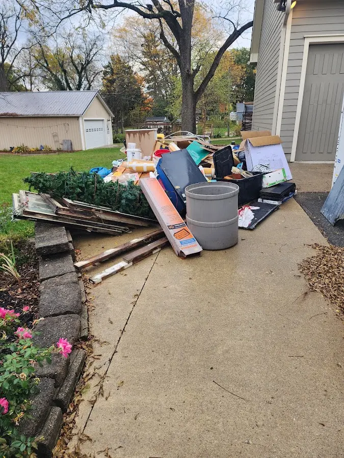 Dumpster being loaded with debris for 12 Yard Dumpster Rental in Lower Saucon
